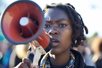 Young african american woman using megaphone photo girl day.