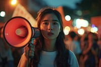 Young asian woman using megaphone portrait adult light.