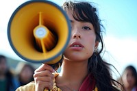 Young latinx woman using megaphone portrait photo girl.