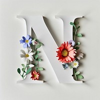 Letter N font flower plant text.