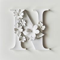 Letter N font flower plant white.