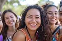 Happy latinx women laughing outdoors smile.