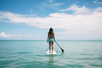 Ocean waves Woman paddle oars.