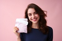 Pink background menstrual pad Young woman smile.