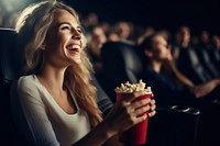 Movie popcorn laughing adult.