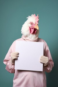 Animal portrait holding chicken.