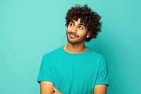 Indian man with curly hair portrait t-shirt standing.