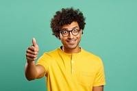 Indian man with curly hair glasses hand pointing.