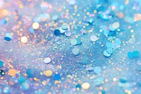 Light blue glitter backgrounds confetti.