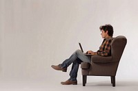 Man with laptop chair furniture armchair.