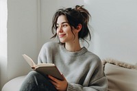 Woman with notebook sweater adult smile.