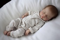 Newborn baby sleeping portrait blanket bed.