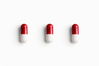 Three capsules pill white red.