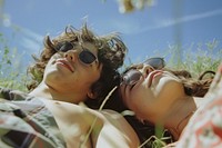 Couple of happy young adult picnic photography sunglasses portrait.