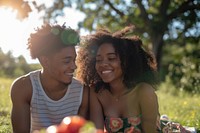 Couple of happy young black adult picnic photography laughing portrait.