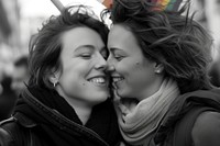 Happy couple lesbian woman with gay pride flag on the street photography portrait adult.