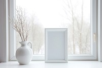 Winter snowy window vase windowsill.