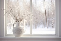 A framed picture of a snowy window windowsill landscape.