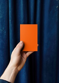 Woman showing orange card