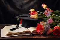 Graduation cap certificate flower table.