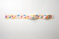 Memphis pattern adhesive strip white background confectionery accessories.