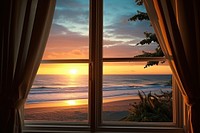 Window see sunrise on beach windowsill nature ocean.