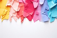 Torn strip of colorful paper backgrounds origami art.