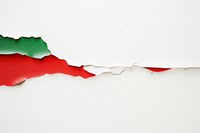 Torn strip of green and red paper border backgrounds white background appliance.