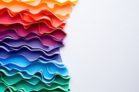 Torn strip of rainbow paper backgrounds art creativity.