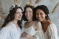 3 happy pregnant diverse women having a photoshoot portrait fashion wedding.