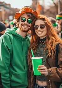 Couple holding green paper cup glasses day togetherness.