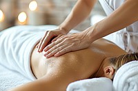 A woman enjoying back massage adult spa relaxation.