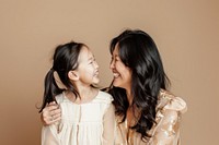Woman laughing with her daughter child affectionate togetherness.