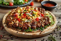 Shish kebab of pork and salad grilling pizza table.