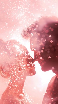Silhouette of man and woman kissing pink red.