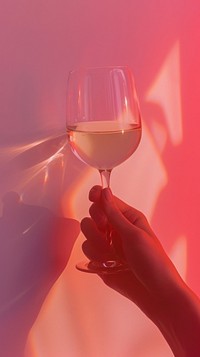 Hand holding wine glass drink red refreshment.