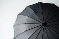 Black umbrella protection sheltering shielding.