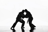 Two judokas fighters fighting men in silhouette adult entertainment choreography.