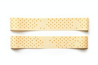 Dot pattern adhesive strip white background bandage yellow.