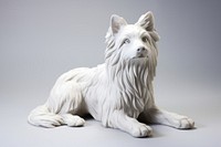 White dog statue figurine mammal animal.
