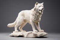 White dog statue figurine mammal animal.