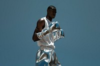 Man wearing silver shining boxing gloves adult exercising standing.