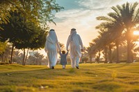Arabian family walking adult hand.