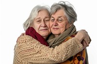 Two elder women hugging portrait adult white background.