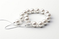 White pearl beads string necklace jewelry white background.