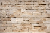 Beige french limestone wall architecture texture.