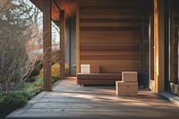 Boxes sitting on porch of modern house architecture hardwood building.