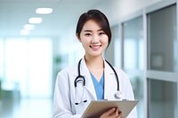 Doctor stand hospital smiling female adult.