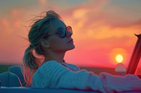 One young blonde attractive woman sunglasses portrait outdoors.