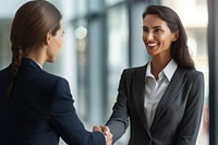 Smiling businesswoman greeting smiling office adult.